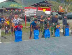 Semarak Perlombaan HUT RI Ke 81, Satgas Yonif 136/Tuah Sakti Rayakan dengan Perlombaan Bersama Anak-Anak Papua di Puncak Jaya Papua Tengah